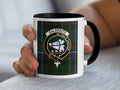 Galbraith Scottish clan crest artwork on an 11 oz black accent mug with a tartan background