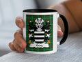 Mug with Gray family crest on a green tartan background.