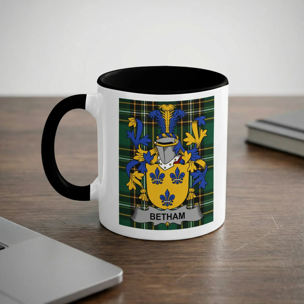 White mug with black handle featuring a blue and green plaid coat of arms with "BETHAM" text.
