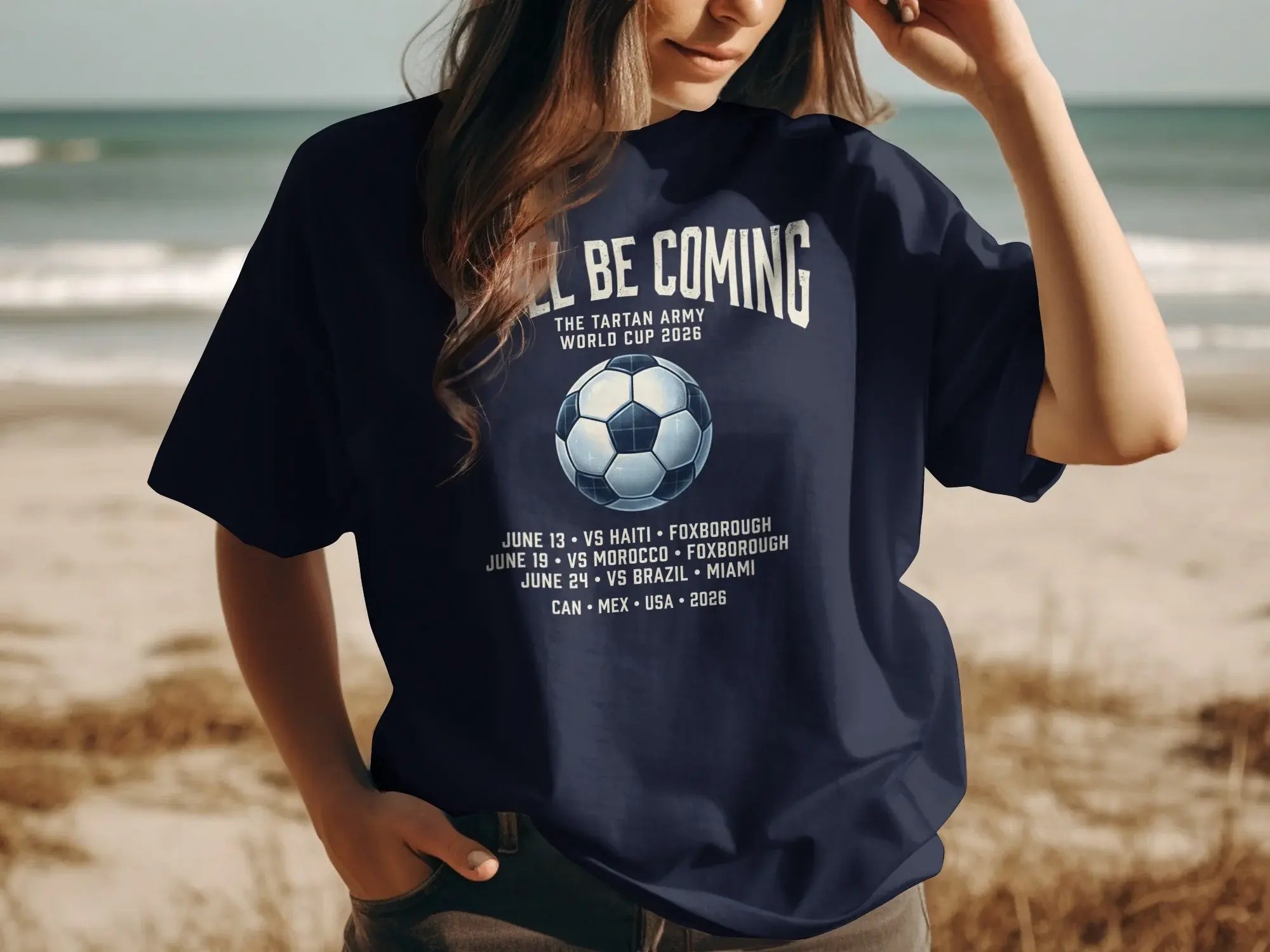 Navy t-shirt with text "Tartan Army World Cup 2026" and match schedule.