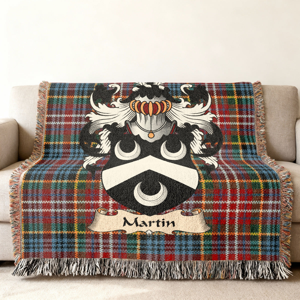 Martin family crest emblem on a Caledonia tartan woven blanket