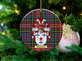 Adamson Scottish clan ceramic ornament with family crest on a Caledonia tartan background, hanging on a Christmas tree