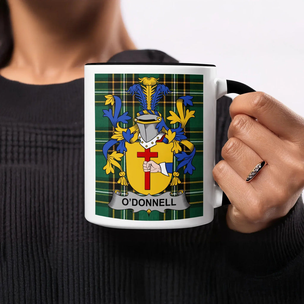 Black mug with O'Donnell family crest on a plaid background.