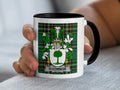 Mug with O'CONNOR surname crest on green plaid background.