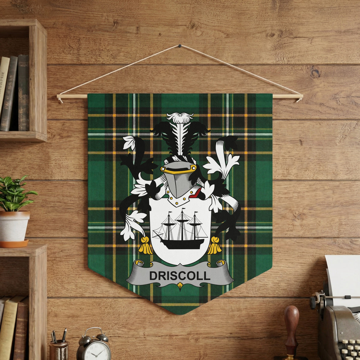 Driscoll family crest on a green tartan banner with a ship and helmet design.