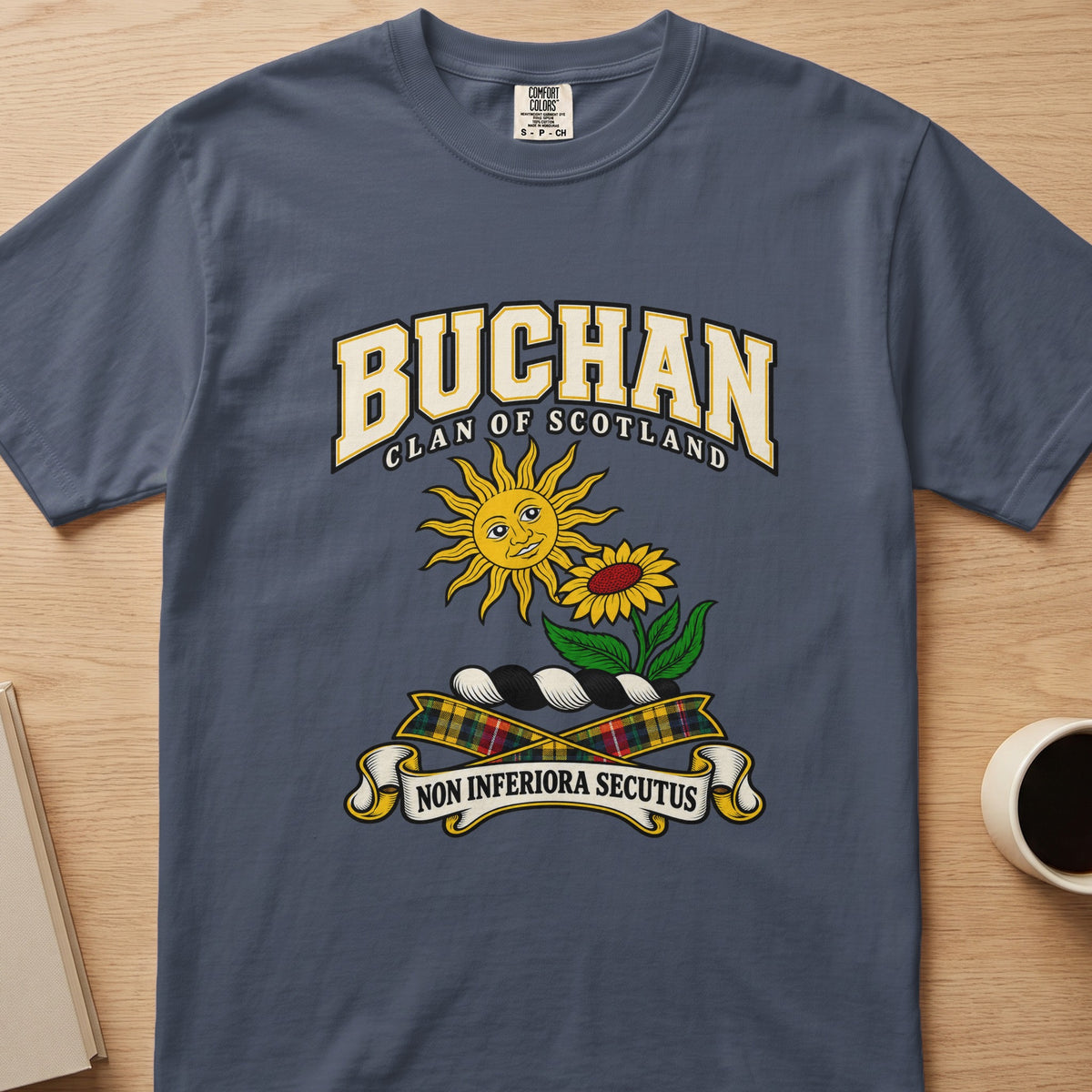 Buchan clan crest with sun and flower on a slate blue Comfort Colors T-shirt, front view