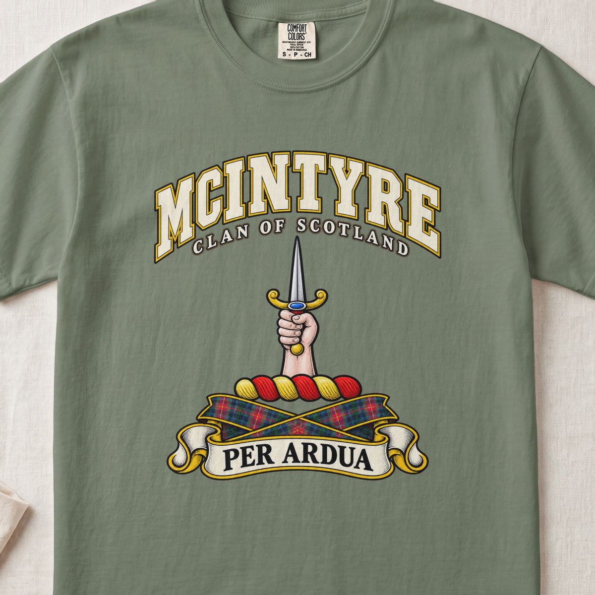 McIntyre Scottish clan T-shirt in Moss, front view with a hand holding an upright dagger and motto banner.