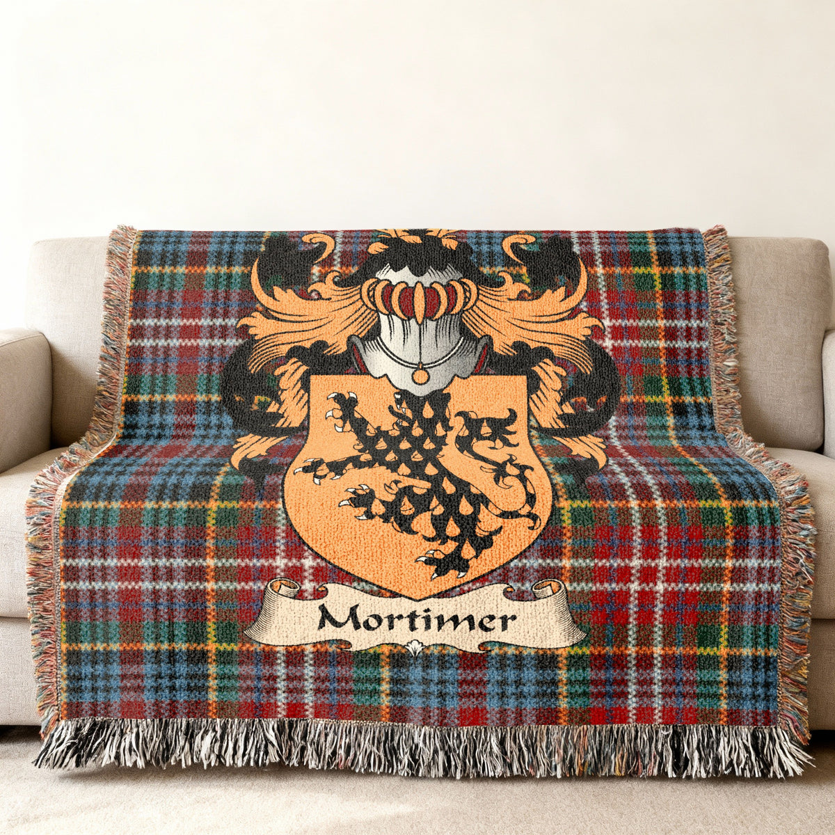 Mortimer Scottish family shield woven blanket on a Caledonia tartan background