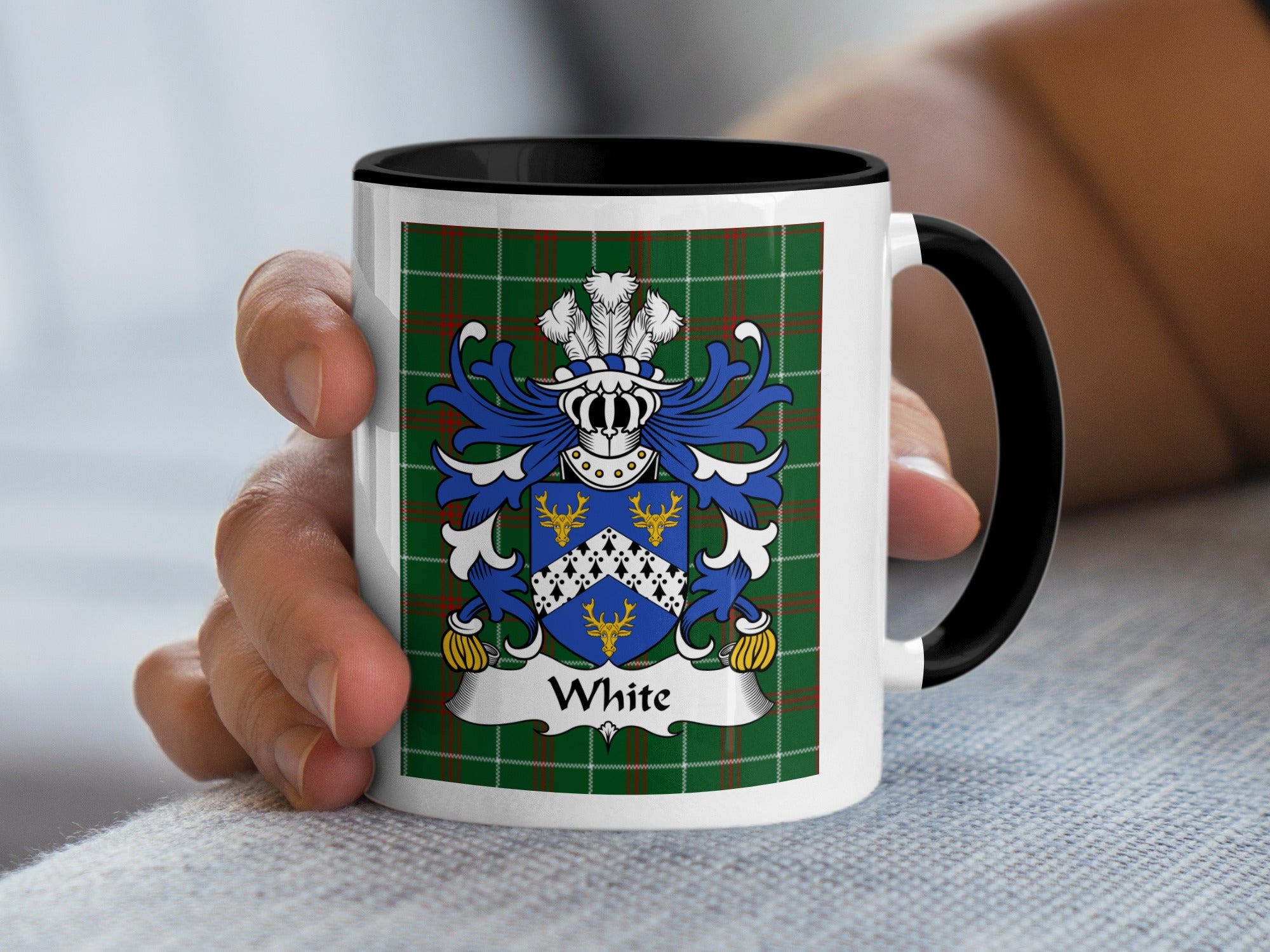 White family crest on a white mug with a black handle and interior.