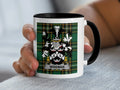 White mug with black rim featuring a green tartan pattern and the Wiseman family crest.