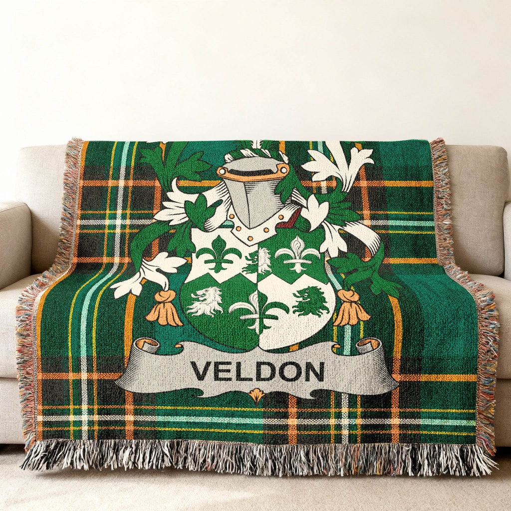 Green plaid throw blanket with the VELDON family crest.