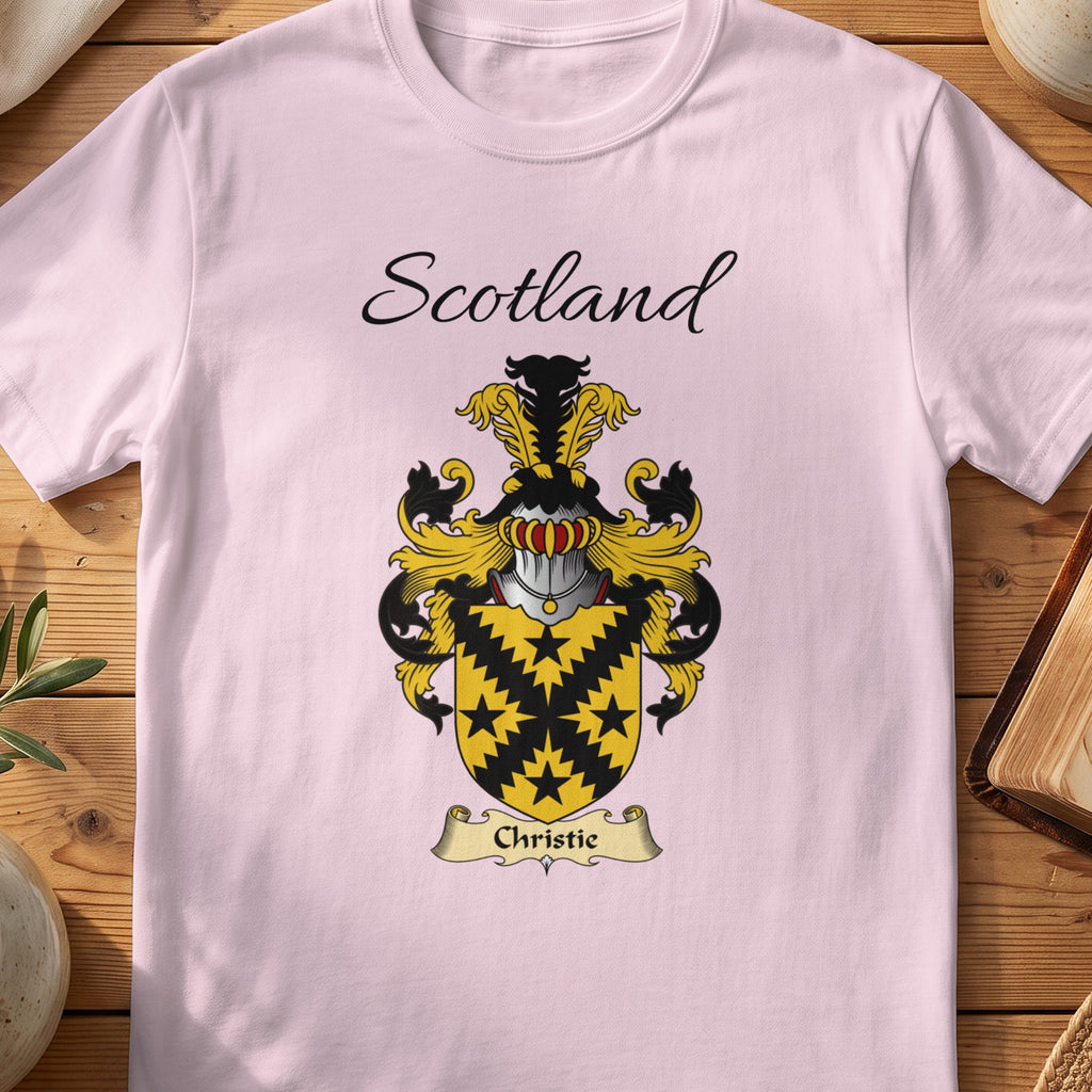 Light Pink Christie Scottish family shield T-shirt featuring a black jagged diagonal cross and star motifs on gold