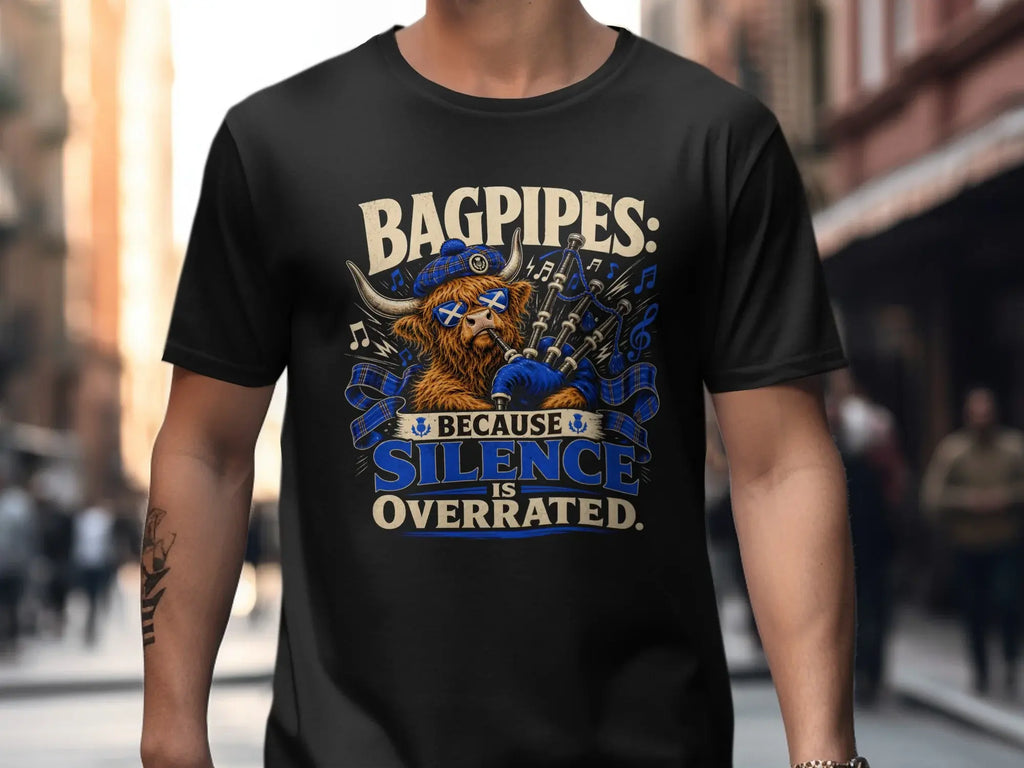 Black t-shirt with "Bagpipes: Because Silence is Overrated" and a highland cow playing bagpipes.