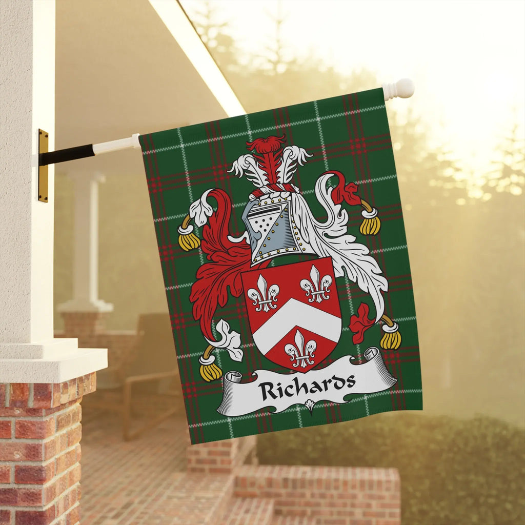Richards family crest flag with green plaid background on flagpole.