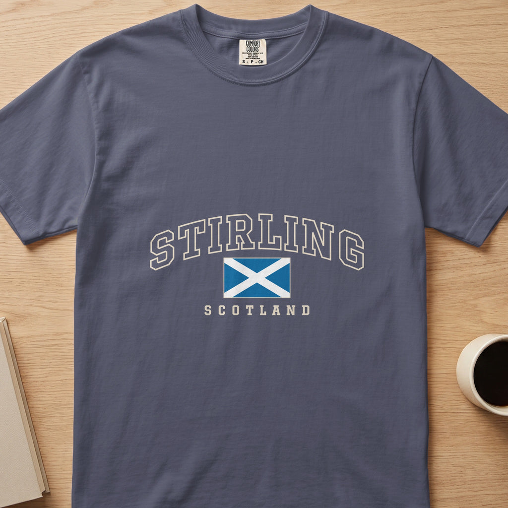 Denim Stirling Scotland Comfort Colors T-shirt laid flat with cream collegiate lettering and the blue-and-white Saltire