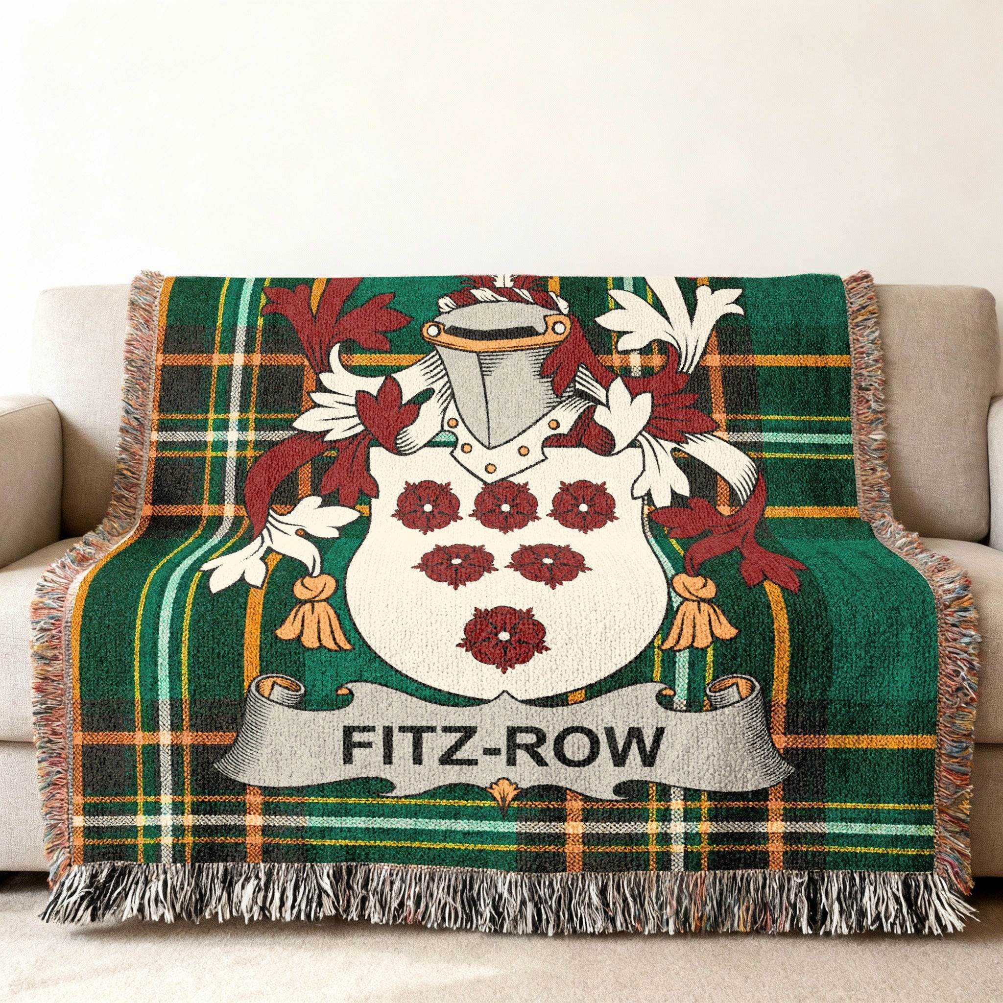 Fitz-Row crest on a green plaid woven blanket draped on a couch.