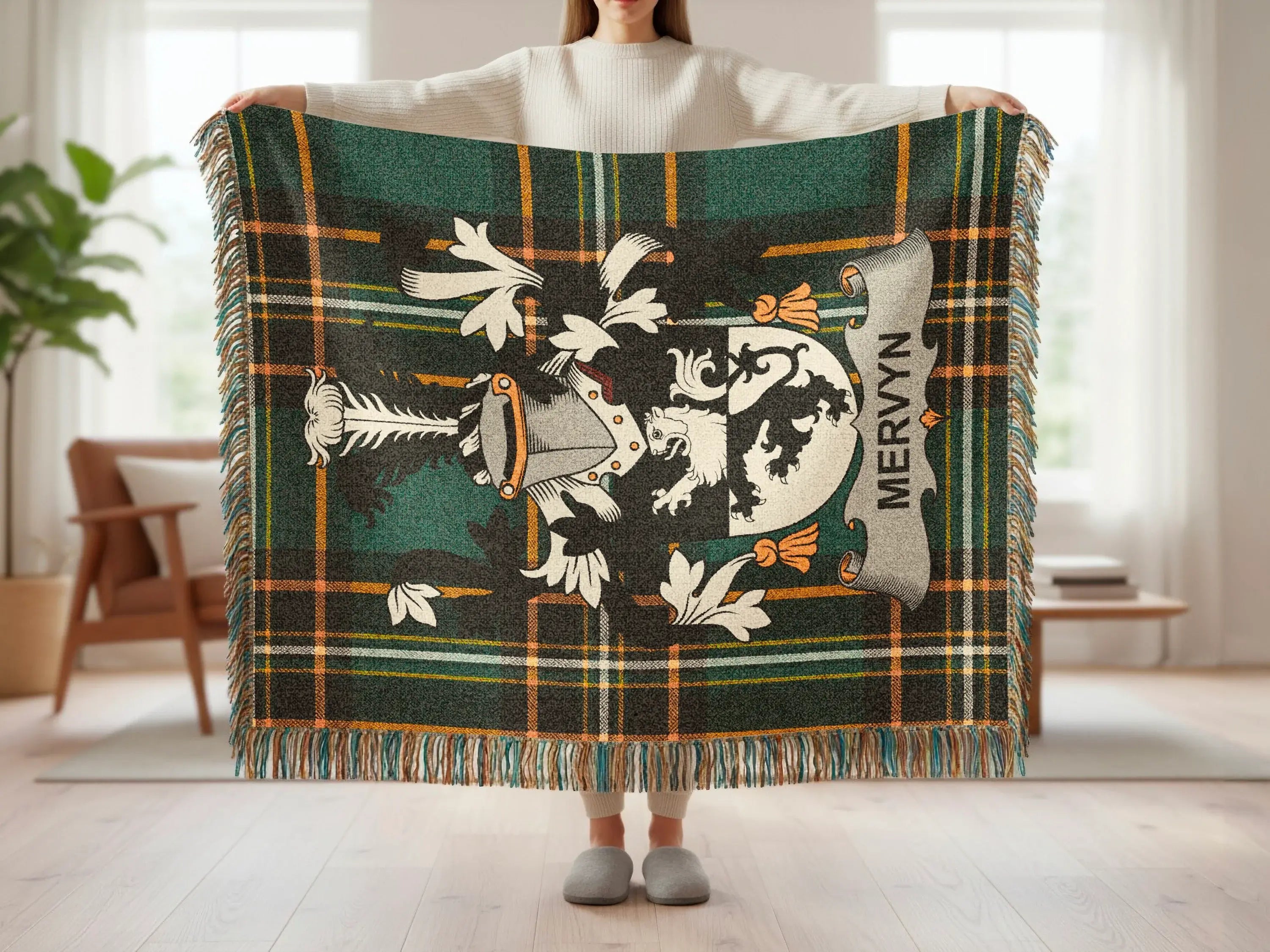 Tartan blanket with Mervyn family crest, draped by a person.