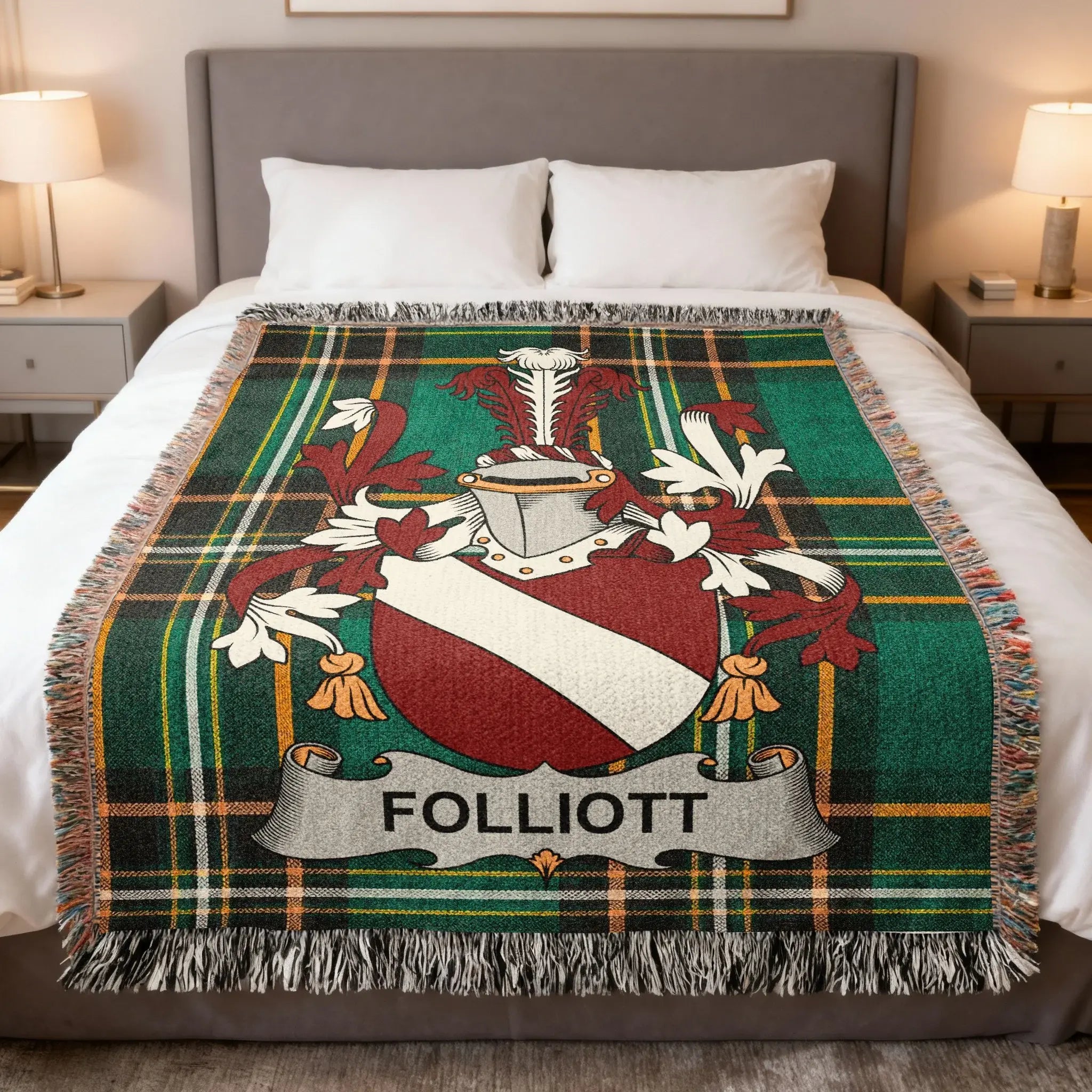 Green tartan blanket with Folliott coat of arms centered on a bed.