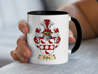White mug with black rim featuring the Begley family crest with a banner.