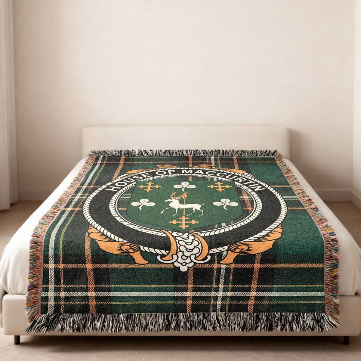 MacCurtin family crest emblem woven blanket displayed on a bed