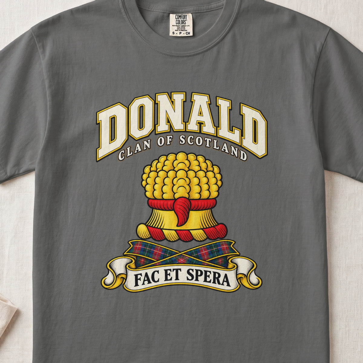 Donald Scottish clan T-shirt in Pepper, front view with a gold sheaf of wheat and motto banner.