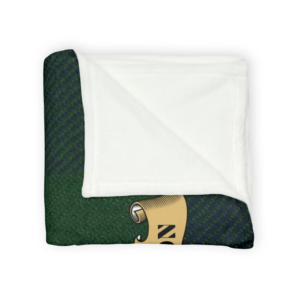 Johnston clan crest throw blanket folded — green and blue plaid, cream interior, Nunquam Non Paratus
