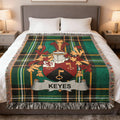 Green plaid throw blanket with Keyes family crest.