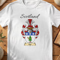 White Kyd Scottish family shield T-shirt featuring a blue top band with white stars above a green motif