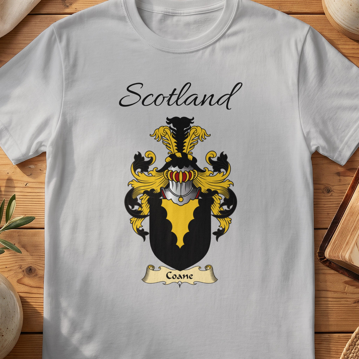 Sport Grey Coane Scottish family shield T-shirt featuring a gold scalloped wedge on black
