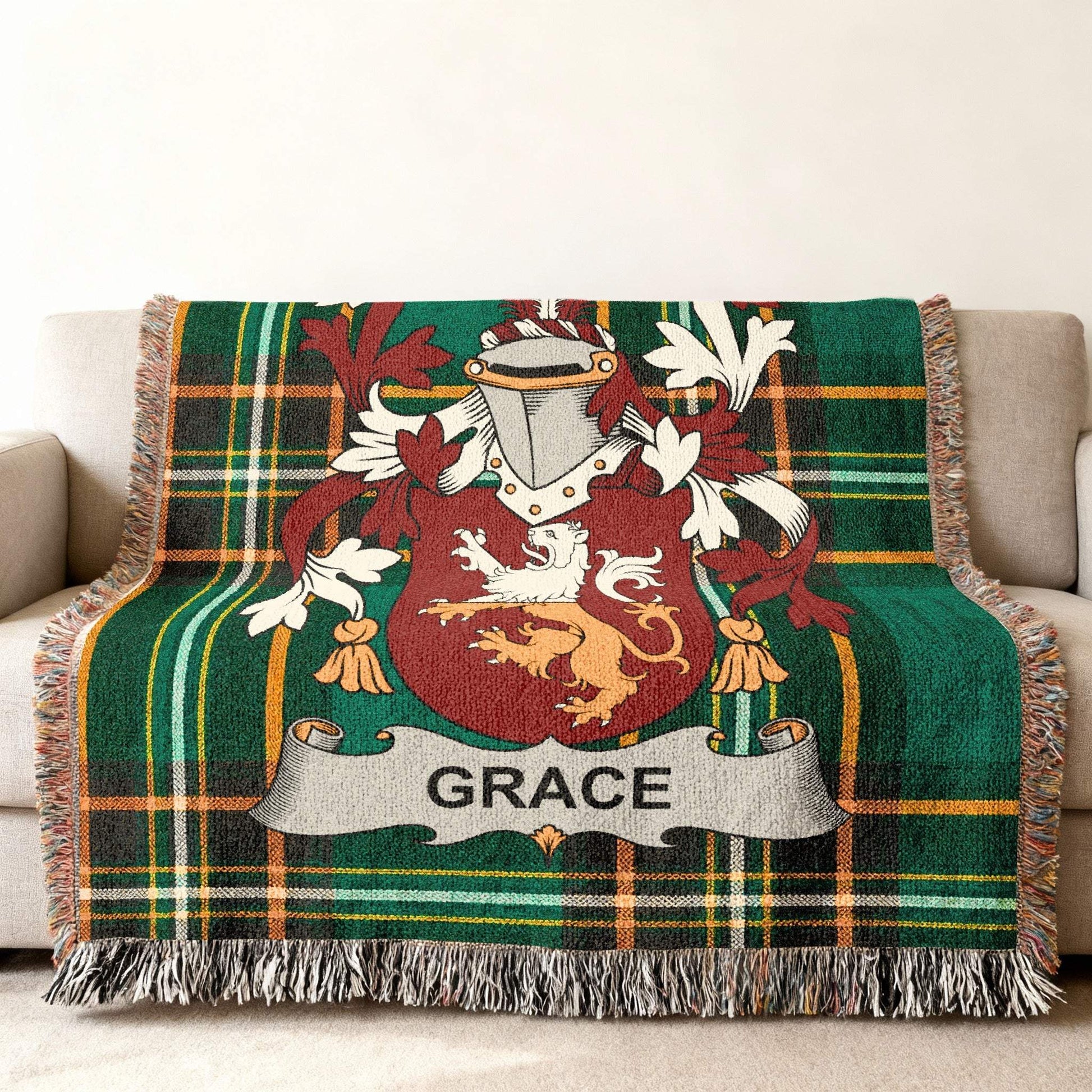 Green plaid throw blanket with Grace family crest.