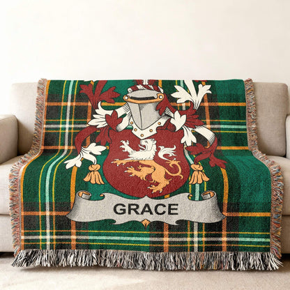 Green plaid throw blanket with Grace family crest.