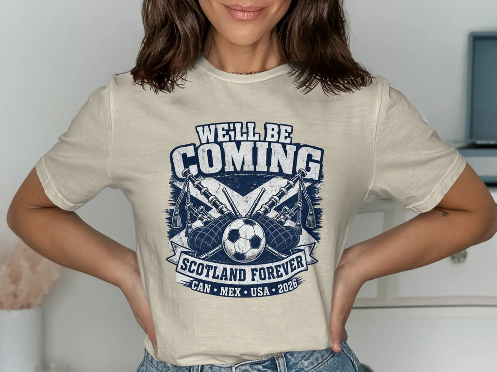 Cream t-shirt with "We'll Be Coming" and "Scotland Forever" text, bagpipes.
