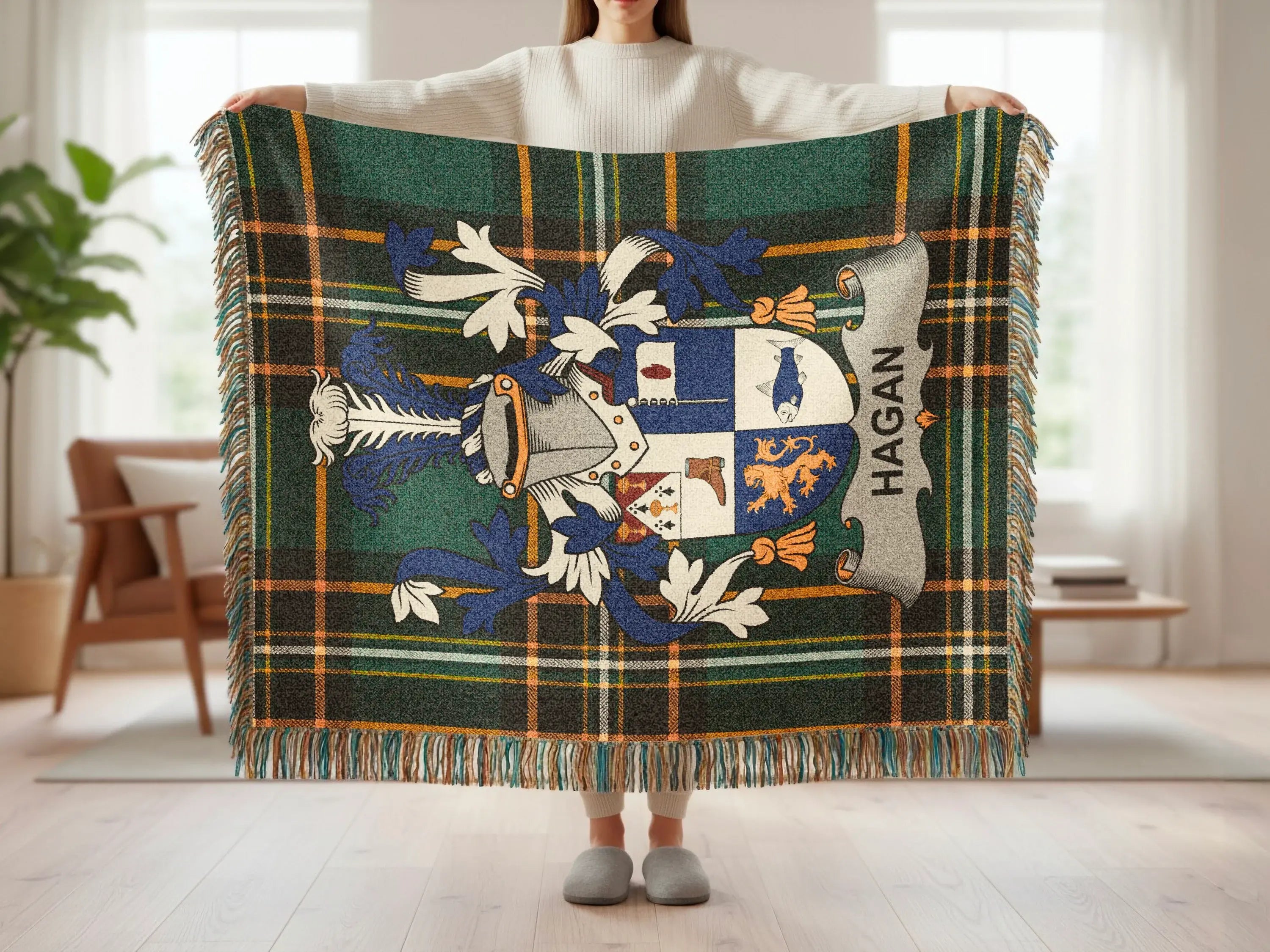 Tartan blanket with Hagan family crest and fringe.