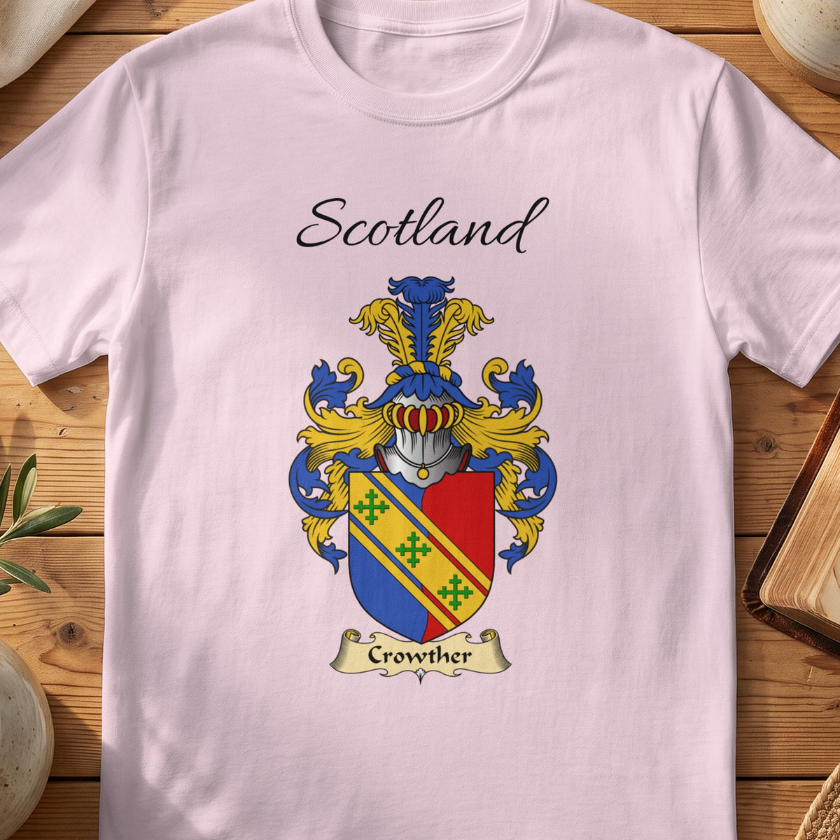 Light Pink Crowther Scottish family shield T-shirt featuring a gold diagonal band across red and blue