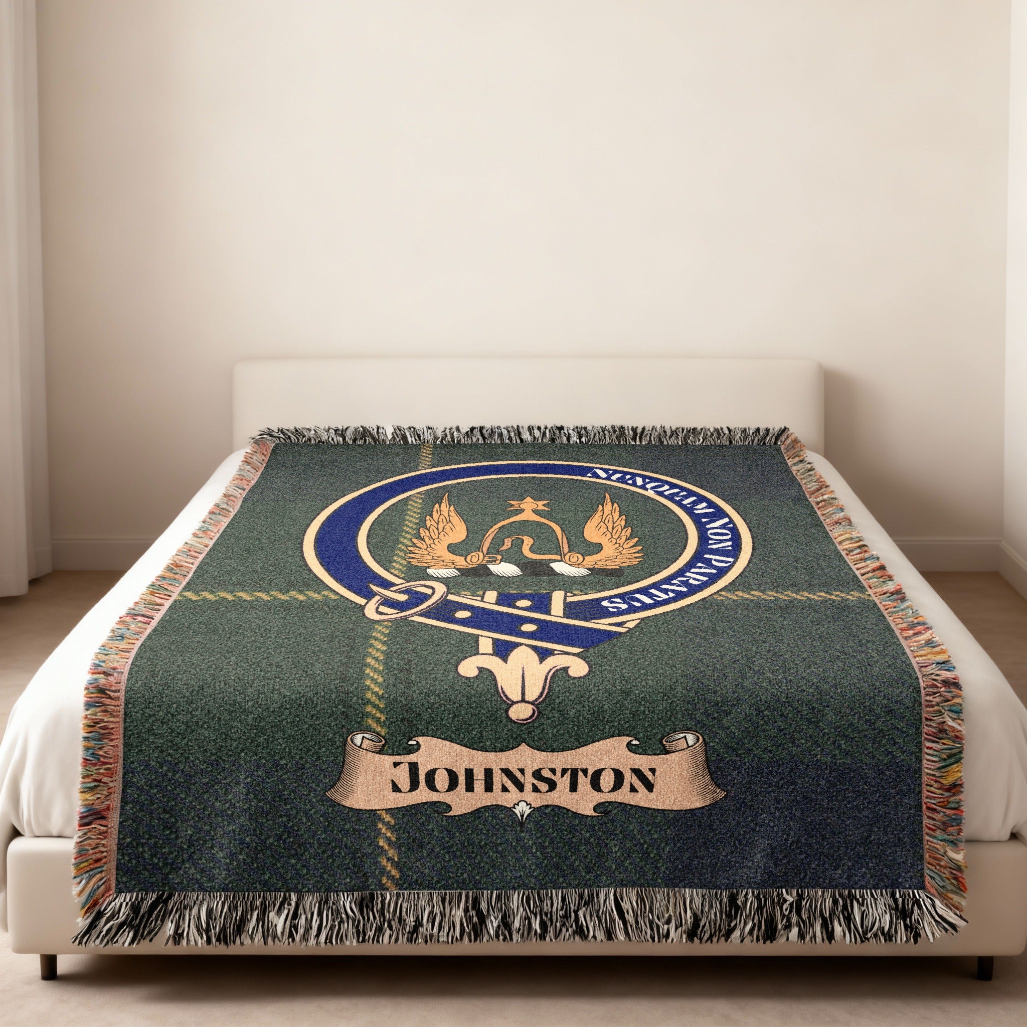 Johnston family crest and name woven into green tartan blanket