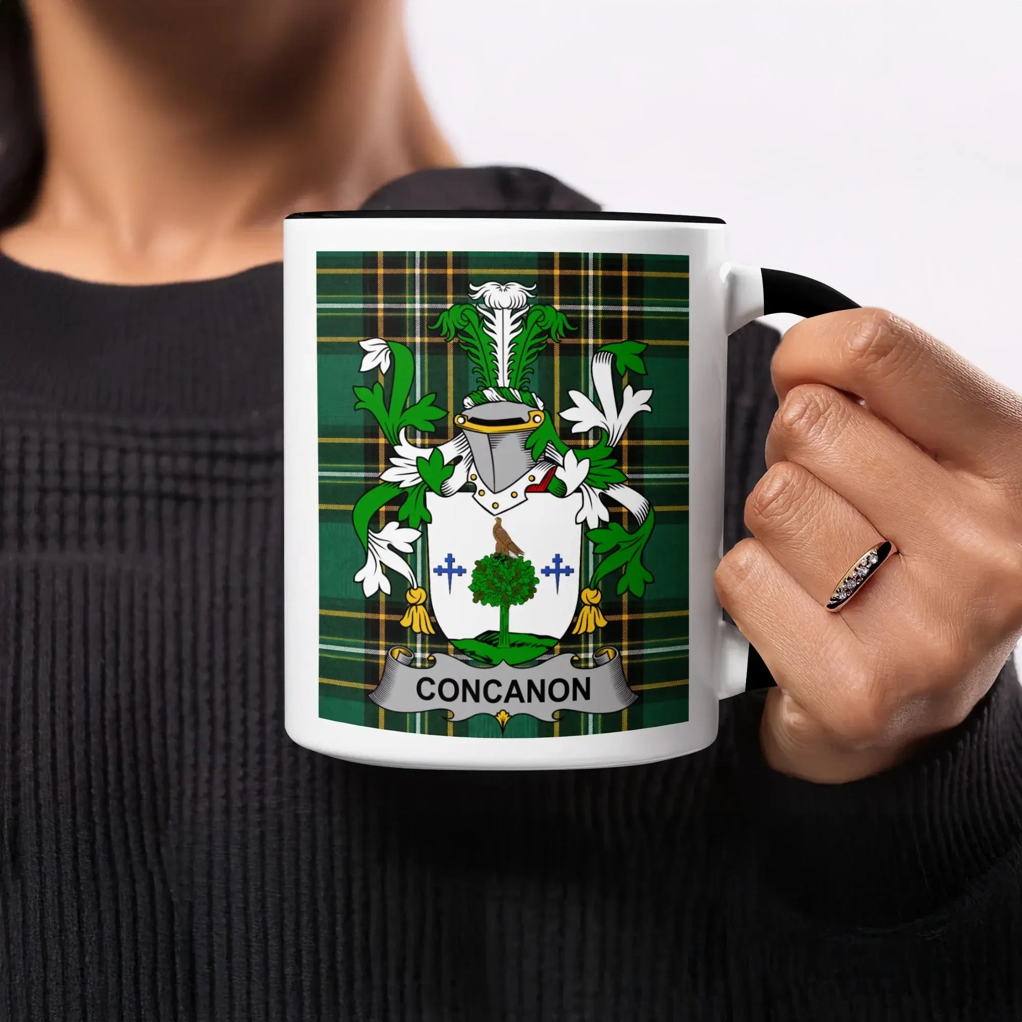 Mug with CONCANON crest on green plaid background.