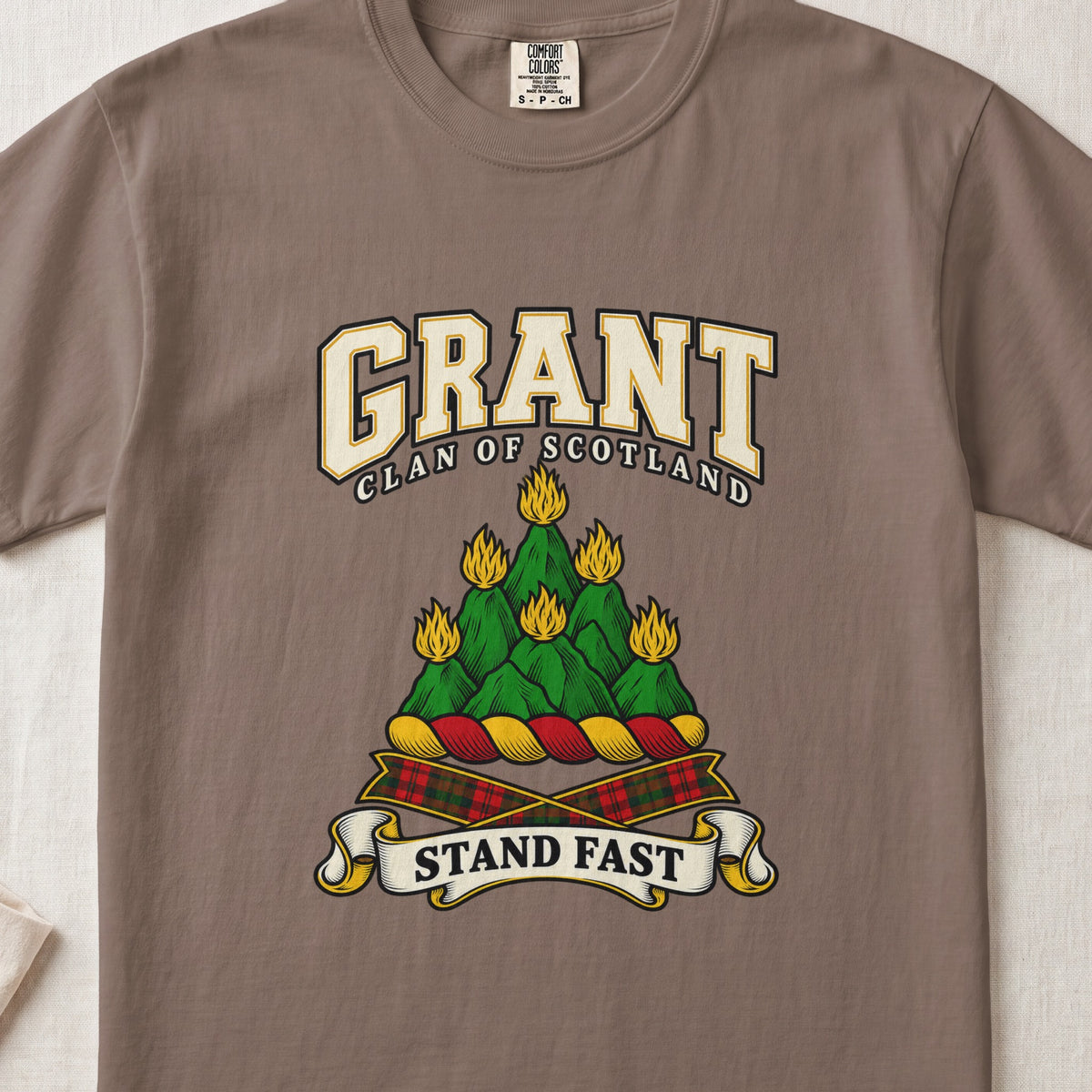 Grant graphic T-shirt in Espresso brown, front flat lay showing varsity lettering and green mountain-like mound with yellow flames.
