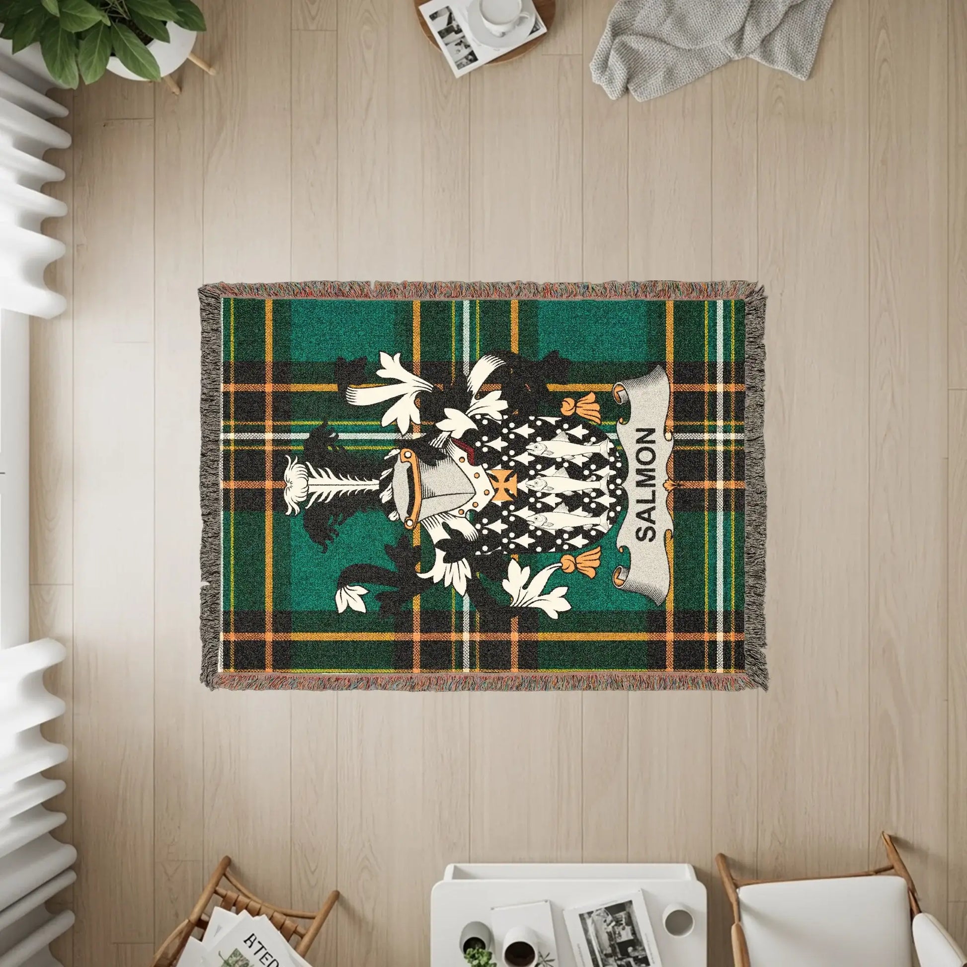 Tartan blanket with the Salmon clan crest.