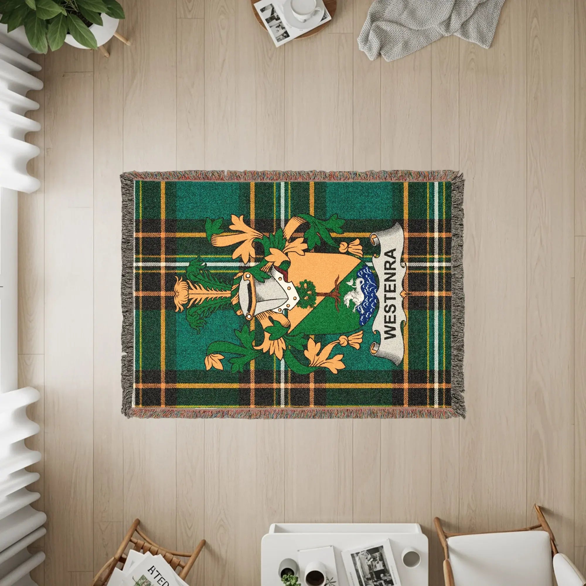 Woven throw blanket with a green tartan pattern and a central crest.