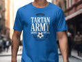 Blue t-shirt with "Tartan Army Can Mex USA 2026" text and soccer graphic.