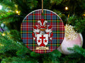 Manson Scottish clan ceramic ornament with family crest on a Caledonia tartan background, hanging on a Christmas tree
