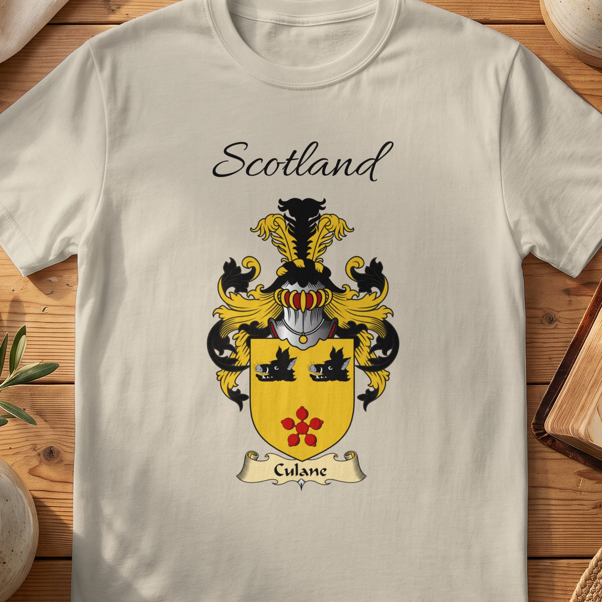 Sand Culane Scottish family shield T-shirt featuring two black boar heads above a red flower