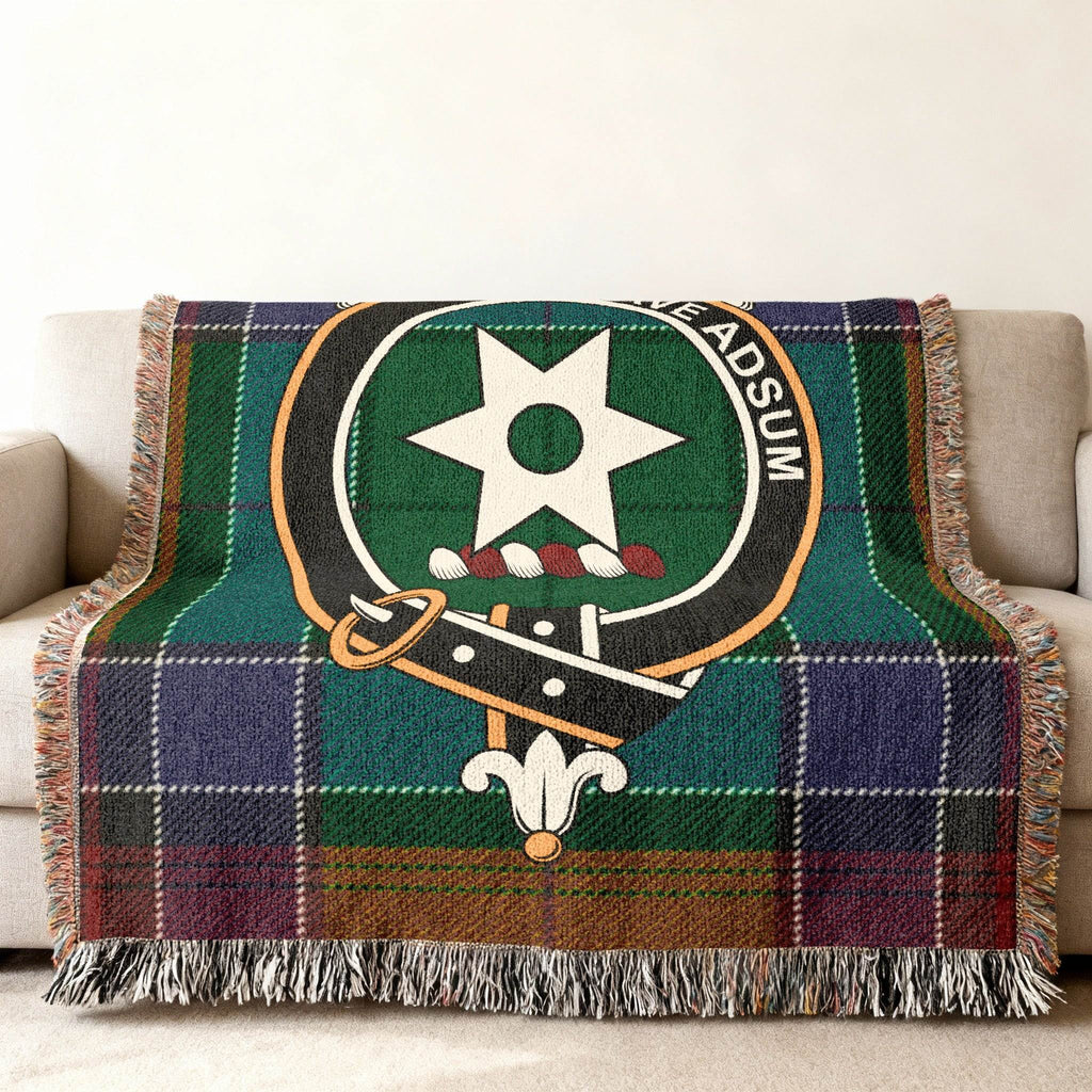 Clan Jardine woven blanket — 80x60 inch full size, Jardine crest and tartan on sofa display