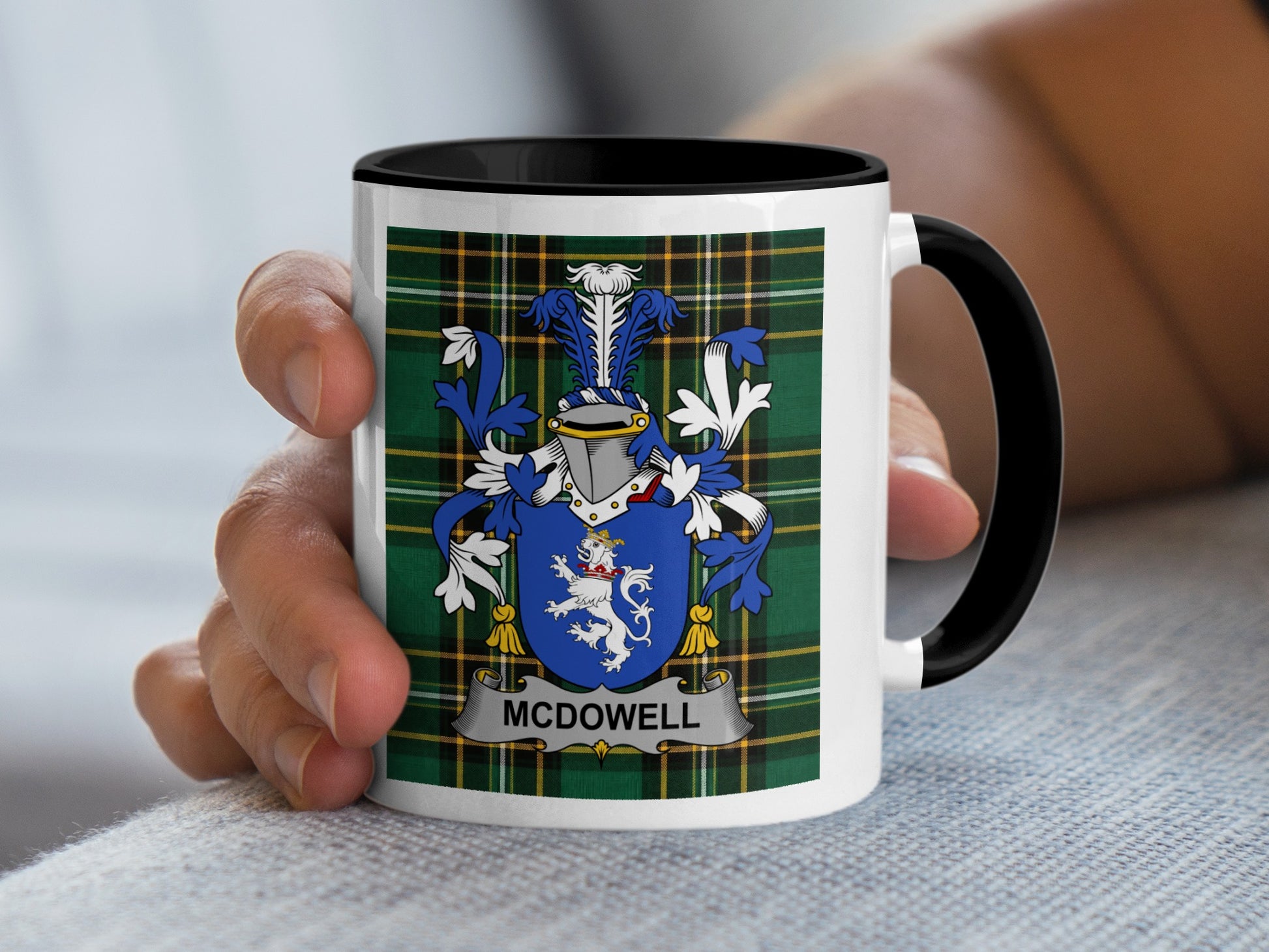 White mug with black rim featuring a blue and white coat of arms with "MCDOWELL" banner.