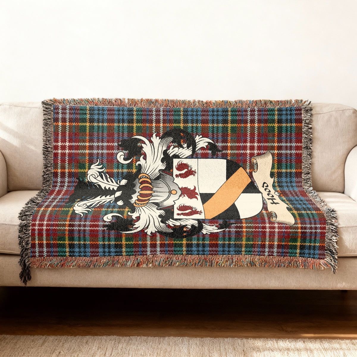 Hood Scottish woven blanket with family shield and Caledonia tartan background