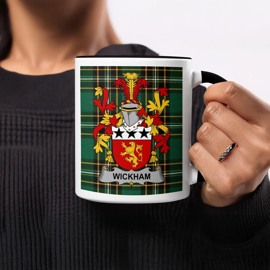 White mug with Wickham coat of arms on green tartan background.