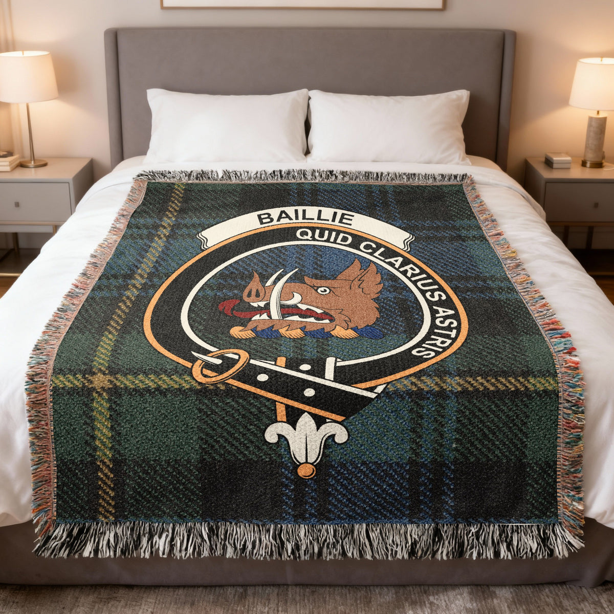 Baillie woven blanket displayed on a bed, with a boar's head on a dark green and blue with yellow lines tartan background