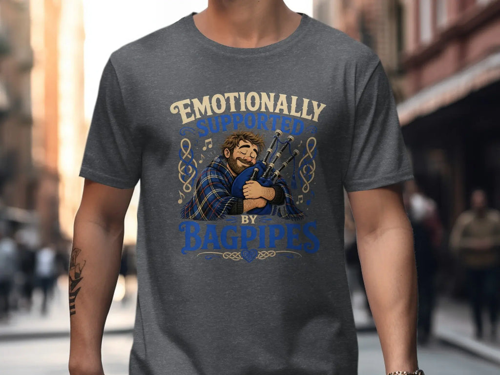 Man wearing t-shirt with "Emotionally Supported by Bagpipes" text and illustration.