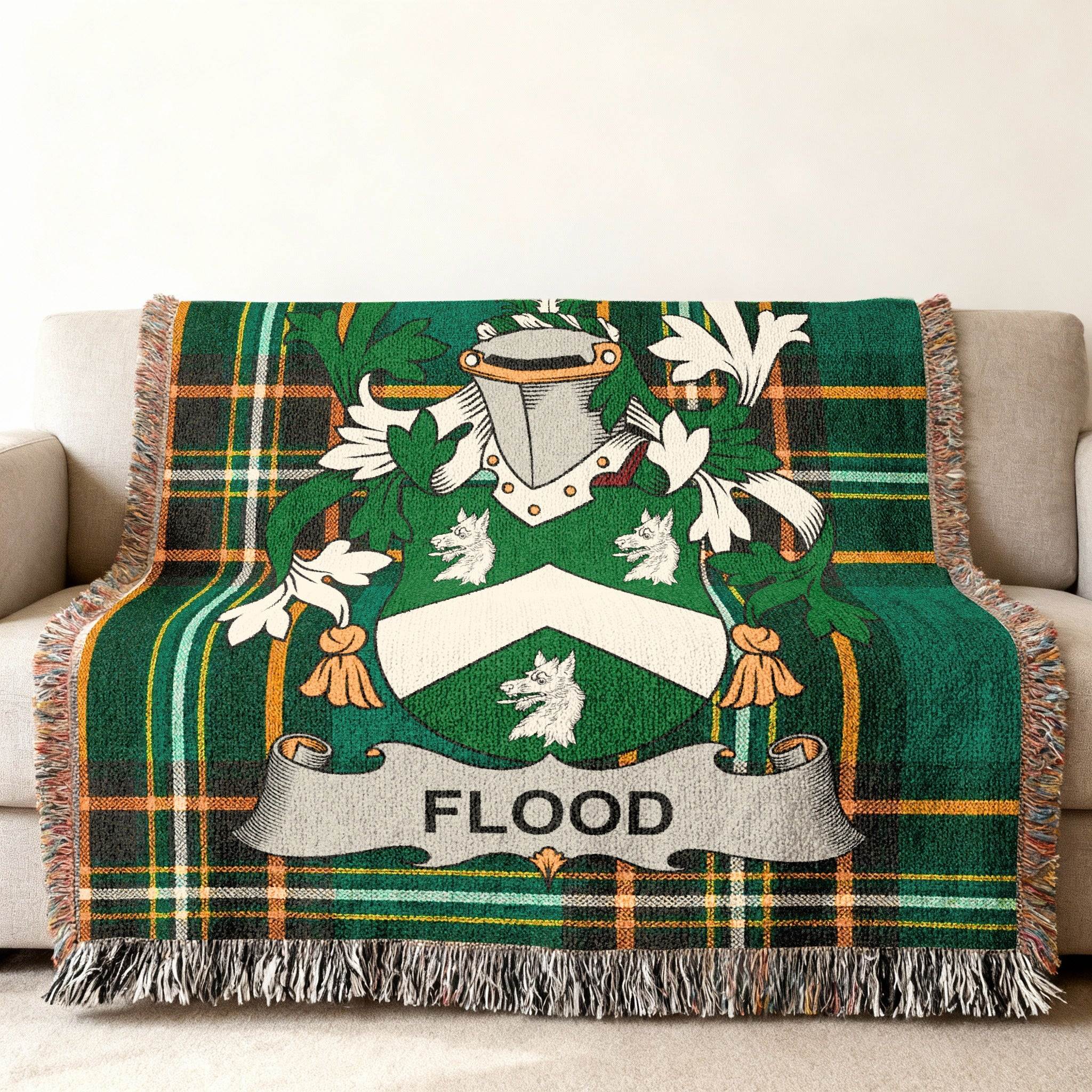 Woven throw blanket with green tartan pattern and Flood family crest.