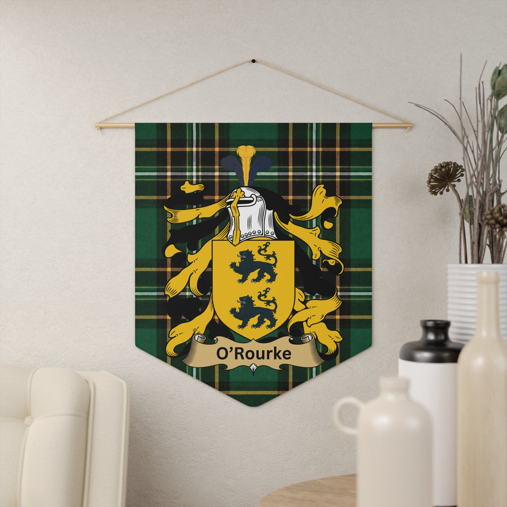 O'Rourke crest on green tartan banner, with lions and helmet, hanging on wall.